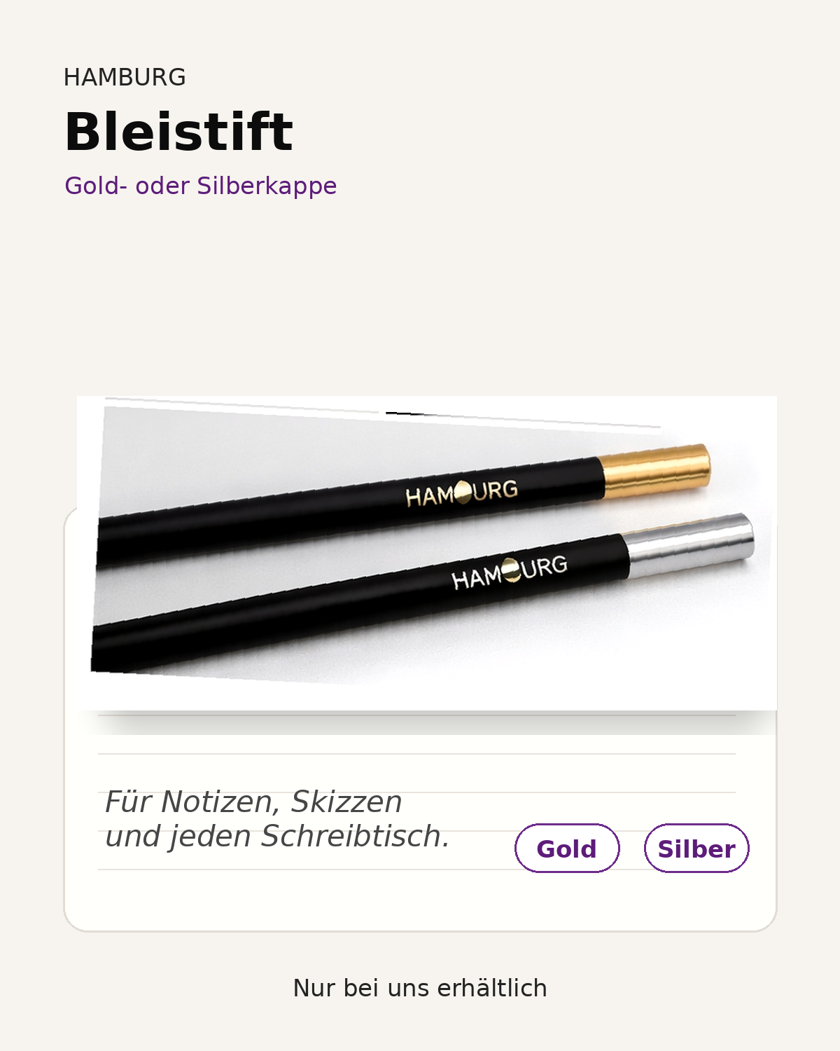 HAMBURG Bleistift in Gold- und Silberausführung auf einem Schreibtisch